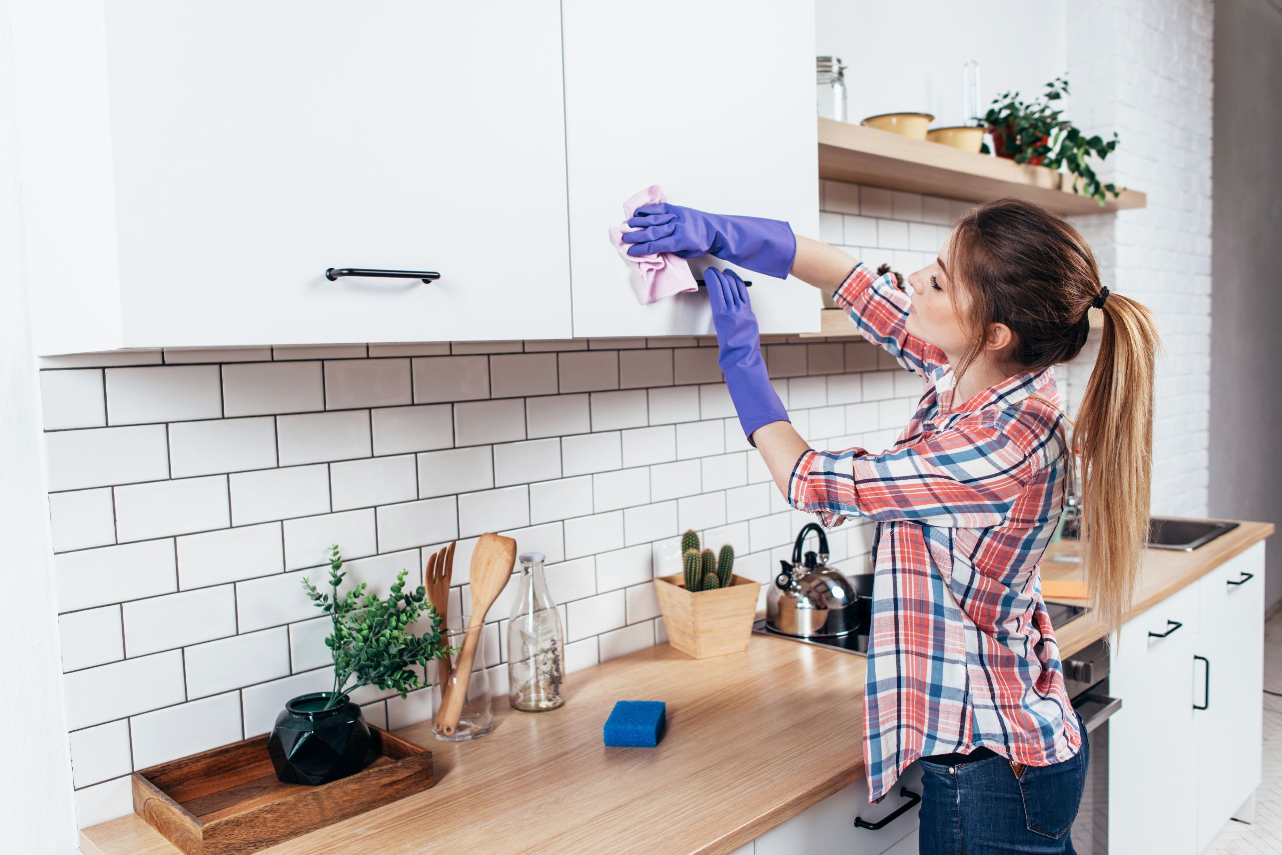 cleaning kitchen cabinet